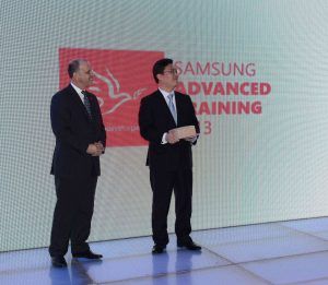 HRH Prince Feisal Ibn Al-Hussein of Jordan standing next to Samsung representative at Advanced Training 2012