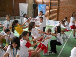 Serbia, girls from the GFP camp playing a game in a gymnasium