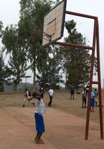 African boy playing basketball